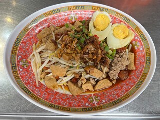 Thai rolled noodle is a dish made of rolled rice noodles, often stuffed with minced pork, shrimp, or other fillings, then served with a flavorful sauce, either dry or in soup.