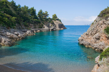 Ieranto bay on the Amalfi Coast in front of the Capri faraglioni, Southern Italy