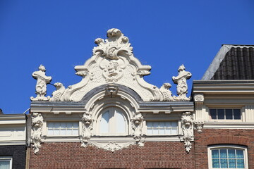Obraz premium Prinsengracht Canal House Facade with White Sculpted Decoration Close Up in Amsterdam, Netherlands