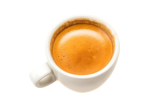 Top down view of a single espresso shot in a white ceramic cup on a black background isolated shot