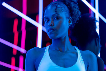 Woman surrounded by laser lights