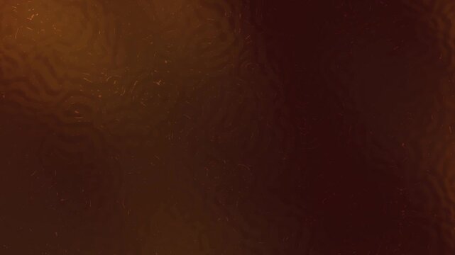Abstract gradient background with dark brown and golden hues, creating a textured and dynamic backdrop suitable for various creative projects.