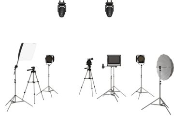 A studio setup featuring multiple light sources, including softboxes, spotlights, and a monitor, all positioned on tripods.  The arrangement suggests a professional photography or videography setting