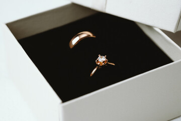 Wedding rings in cream gift box with black velvet interior