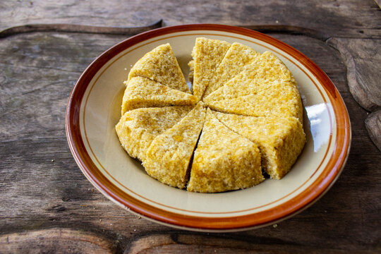 Krasikan is traditional food/ snack from java made glutinous rice, coconut milk, brown sugar, grated coconut, teaspoon of betel lime water served wood background