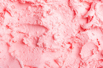 Close-up of smooth, pink ice cream, showcasing its creamy texture and swirls