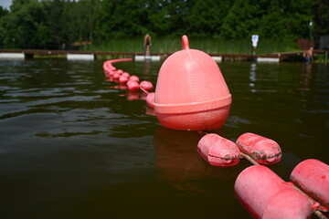 Buoys, warning floats at the bathing area. Safe recreation by the water.