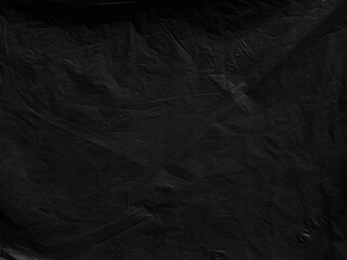 Black background plastic wrinkle bag film glossy crumpled overlay package rough wrap material pack...
