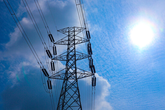 the pylon outline, Very High Voltage Power Lines (Indonesia : SUTET) on blue sky