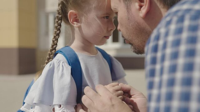 close-up face of little upset child, divorce single father family, student daughter problem with school backpack, disappointment stress kid emotion, child education time, paren psychology of sadness.