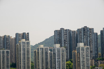 Fototapeta premium modern apartment building with balconies and laundry drying in Chongqing, China