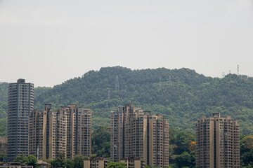 Obraz premium modern apartment building with balconies and laundry drying in Chongqing, China