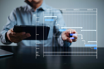roject manager working and update tasks with milestones progress planning and Gantt chart scheduling diagram