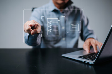Man using digital checklist interface on laptop. Concept of document control, project planning,...