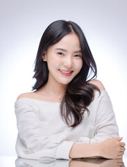 Portrait happy cheerful young asian beautiful woman clean fresh skin, showcasing healthy and wellness smile look at camera on white background Ideal facial skincare glowing beauty treatment promotions