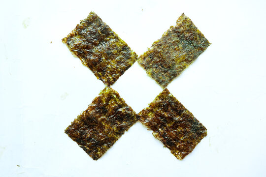 nori seaweed isolated on white background. Japanese food nori. Dry seaweed sheets.