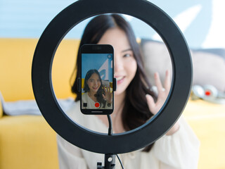 Close up mobile phone digital camera asian young beautiful happy funny woman smile live broadcast...