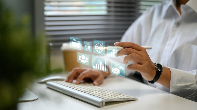 Businesswoman accessing virtual tools for global data and performance tracking - Powered by Adobe