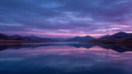 Serene mountain lake at dawn, vibrant hues reflected