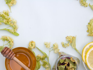 Tea with honey and lime on a light blue table, flu prevention, flat serving