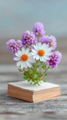 Delicate White and Purple Flower Arrangement on Rustic Book