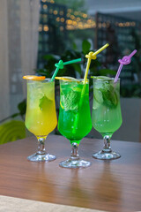 Lemonades with ice and a slice of lemon on top
