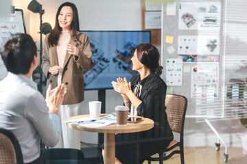 Business culture asian team working together meeting positive emotion at modern office