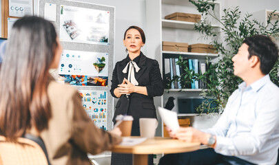 Leader business mature woman asian working together traning team skill positive emotion at modern office
