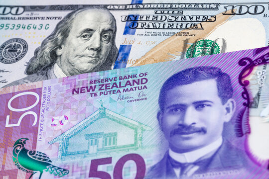 100 US dollar and 50 New Zealand dollar banknotes. International trade concept