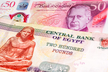 50 British pound and 200 Egyptian pound banknotes. International trade concept