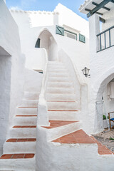 White Mediterranean Architecture With Curved Staircase in Binibeca Vell. Menorcan Fishing Village, Terracotta Steps, Whitewashed Walls, Spanish Architecture