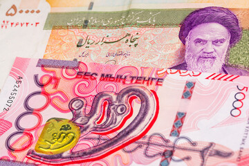 50000 Iranian rial and 5000 Kazakh tenge banknotes. International trade concept