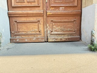 A crumbling inner city building gate.