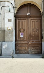 A crumbling inner city building gate.