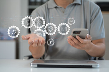Artificial Intelligence technology. Man using a smartphone and laptop computer chatting with an intelligent artificial intelligence.