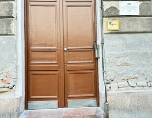 A crumbling inner city building gate.