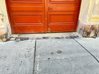 A crumbling inner city building gate.