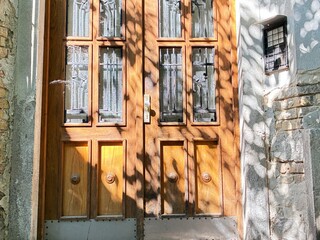 A crumbling inner city building gate.