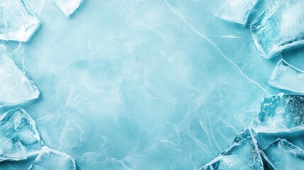 Obraz premium An artistic representation of cracked ice pieces scattered on a light blue surface, symbolizing both fragility and beauty in nature's ephemeral creations.