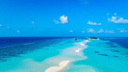 Aerial view in the island with white sand beach as coastline in summer Maldives