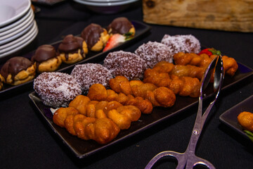 Various pastries on display including koeksisters