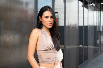 Confident Asian Woman Outdoors in Stylish Outfit