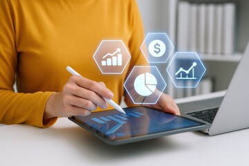 Person using a tablet computer with digital financial data overlays.