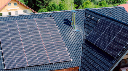 Solar panels providing green energy on residential roof