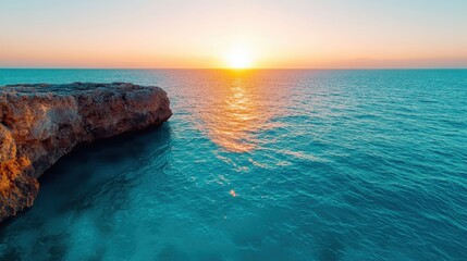 An idyllic sunset view over calm ocean waters, where the golden sun reflects on the surface, creating a serene and peaceful atmosphere.
