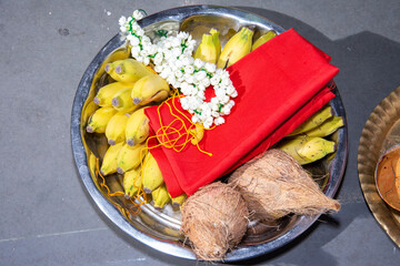 Traditional South Indian Ritual Plate with Coconuts, Bananas, and Garland