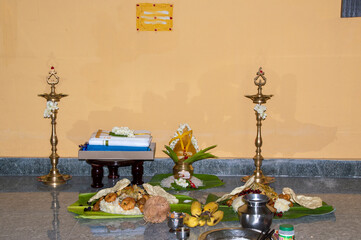Traditional South Indian Ritual Offering with Banana Leaves and Sacred Objects