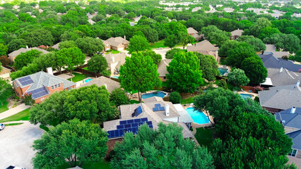 Aerial view lush green homes with rooftop solar panel arrays, angled installations for optimal sunlight capture, supporting clean efficiency energy, lower bills, sustainable, DFW metroplex, Texas