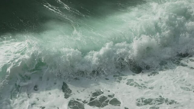 Ocean Waves Crashing Rough sea surge occurs on coast due to wind energy creating swell day.
