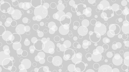 Grey background and white polka dot pattern as blur or snow drops. Luxury wallpaper for a holiday or packaging.
